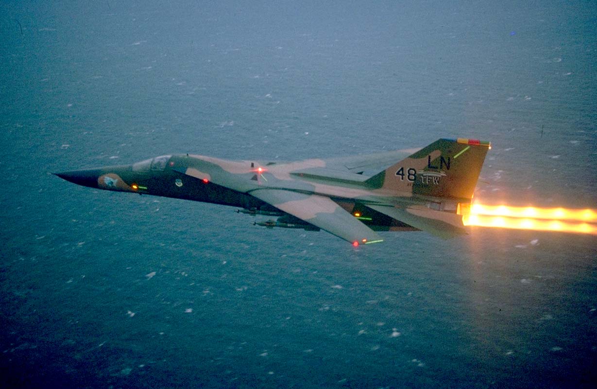 F-111 from RAF Lakenheath in afterburner low over water